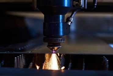 CNC Laser cutting of metal close up, modern industrial technology. Small depth of field CNC Laser cutting of metal close up, modern industrial technology. Small depth of field.