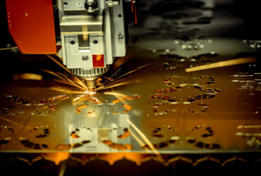 CNC Laser cutting of metal, modern industrial technology. . CNC Laser cutting of metal, modern industrial technology. . Small depth of field. Warning - authentic shooting in challenging conditions. A little bit grain and maybe blurred.
